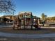 playground with play structures and shaded seating at 5211 W Maldonado Rd, Laveen, AZ 85339