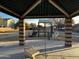 playground with play structures and shaded seating at 5211 W Maldonado Rd, Laveen, AZ 85339