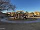 playground with play structures and shaded seating at 5211 W Maldonado Rd, Laveen, AZ 85339