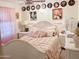 Charming bedroom with a white bed and Marilyn Monroe decor at 5725 E Good Pasture Ln, Florence, AZ 85132