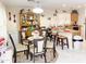 Bright dining area with seating for six and views into the kitchen at 5725 E Good Pasture Ln, Florence, AZ 85132