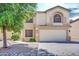 Two-story house with a large garage and mature trees at 5725 E Good Pasture Ln, Florence, AZ 85132