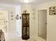 Bright hallway with decorative curio cabinet at 5725 E Good Pasture Ln, Florence, AZ 85132