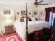 Spacious main bedroom with a large four-poster bed at 5725 E Good Pasture Ln, Florence, AZ 85132