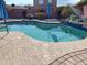 Refreshing kidney-shaped pool with a tiled water feature at 5725 E Good Pasture Ln, Florence, AZ 85132