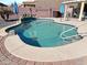 Inviting pool with patio and a surrounding brick border at 5725 E Good Pasture Ln, Florence, AZ 85132