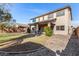 Two-story home with covered patio and grassy backyard at 581 W Reeves Ave, San Tan Valley, AZ 85140