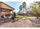 Backyard patio with covered seating and grassy area at 581 W Reeves Ave, San Tan Valley, AZ 85140