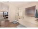 Bathroom features a shower, bathtub, and tiled flooring at 581 W Reeves Ave, San Tan Valley, AZ 85140