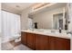 Bathroom with double vanity and shower/tub combo at 581 W Reeves Ave, San Tan Valley, AZ 85140