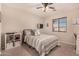 Bedroom with double bed, shelving, and window coverings at 581 W Reeves Ave, San Tan Valley, AZ 85140