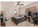 Bright bedroom with double bed, desk, and window coverings at 581 W Reeves Ave, San Tan Valley, AZ 85140