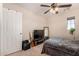 Bedroom with a double bed, TV, and musical instruments at 581 W Reeves Ave, San Tan Valley, AZ 85140