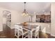 Farmhouse dining table with seating for six in the dining area at 581 W Reeves Ave, San Tan Valley, AZ 85140