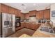 Kitchen with stainless steel appliances and wood cabinets at 581 W Reeves Ave, San Tan Valley, AZ 85140