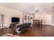 Living room with dark hardwood floors and sectional sofa at 581 W Reeves Ave, San Tan Valley, AZ 85140