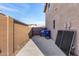 Side yard with gated access and storage area at 581 W Reeves Ave, San Tan Valley, AZ 85140