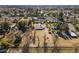 Aerial view of a house with a large lot and surrounding landscape at 616 E Country S Plz, Gilbert, AZ 85234