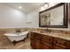 Elegant bathroom with soaking tub and copper sink at 616 E Country S Plz, Gilbert, AZ 85234