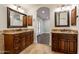 Double vanity bathroom with copper sinks and access to bedroom at 616 E Country S Plz, Gilbert, AZ 85234