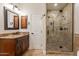 Bathroom with walk-in shower and granite vanity at 616 E Country S Plz, Gilbert, AZ 85234