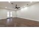 Bright bedroom featuring hardwood floors and French doors at 616 E Country S Plz, Gilbert, AZ 85234