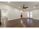 Hardwood floor bedroom with access to backyard at 616 E Country S Plz, Gilbert, AZ 85234