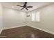 Simple bedroom with wood floors and ceiling fan at 616 E Country S Plz, Gilbert, AZ 85234