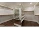 Large walk-in closet with ample shelving and hanging space at 616 E Country S Plz, Gilbert, AZ 85234