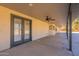 Covered patio with double doors leading to backyard at 616 E Country S Plz, Gilbert, AZ 85234