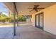 Covered patio with backyard access and ceiling fan at 616 E Country S Plz, Gilbert, AZ 85234