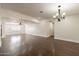 Elegant dining room with hardwood floors and chandelier at 616 E Country S Plz, Gilbert, AZ 85234