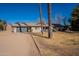 Single-story home with a large front yard and attached garage at 616 E Country S Plz, Gilbert, AZ 85234