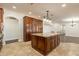 Island kitchen with granite countertops and wood cabinets at 616 E Country S Plz, Gilbert, AZ 85234