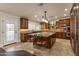 Island kitchen with granite countertops and wood cabinets at 616 E Country S Plz, Gilbert, AZ 85234