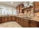 Kitchen features granite counters and wood cabinets at 616 E Country S Plz, Gilbert, AZ 85234