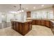 Large kitchen with granite counters and wood cabinets at 616 E Country S Plz, Gilbert, AZ 85234