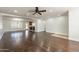 Open living area featuring hardwood floors and a view into the kitchen at 616 E Country S Plz, Gilbert, AZ 85234