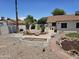 Landscaped backyard with fire pit and rock garden at 620 S Laveen Dr, Chandler, AZ 85226