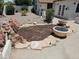 Landscaped backyard with fire pit and rock garden at 620 S Laveen Dr, Chandler, AZ 85226