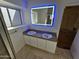 Modern bathroom with double vanity and LED-lit mirror at 620 S Laveen Dr, Chandler, AZ 85226