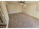 Large bedroom with carpeted floors and ceiling fan at 620 S Laveen Dr, Chandler, AZ 85226