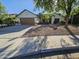 House exterior showcasing a brown garage door and desert landscaping at 620 S Laveen Dr, Chandler, AZ 85226