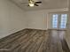 Bright living room with laminate floors and access to a patio at 620 S Laveen Dr, Chandler, AZ 85226