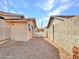 Side yard with gravel landscaping and a block wall at 6554 E Dallas St, Mesa, AZ 85205