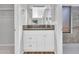 Bathroom with modern vanity, dark countertop, and a walk-in shower at 6554 E Dallas St, Mesa, AZ 85205