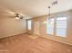 Bright living room with neutral carpeting and large windows at 6710 E University Dr # 147, Mesa, AZ 85205