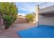 Landscaped backyard with gravel and blue pad at 7304 E Northridge Cir, Mesa, AZ 85207