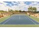 Well-maintained tennis court with green surrounding at 7304 E Northridge Cir, Mesa, AZ 85207