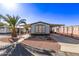 Inviting manufactured home exterior with carport and palm tree landscaping at 747 E Germann Rd # 81, San Tan Valley, AZ 85140